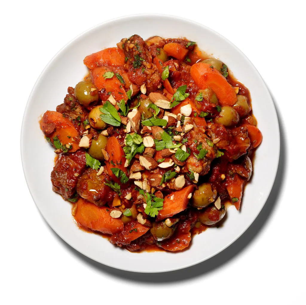 Agneau braisé aux tomates et aux amandes